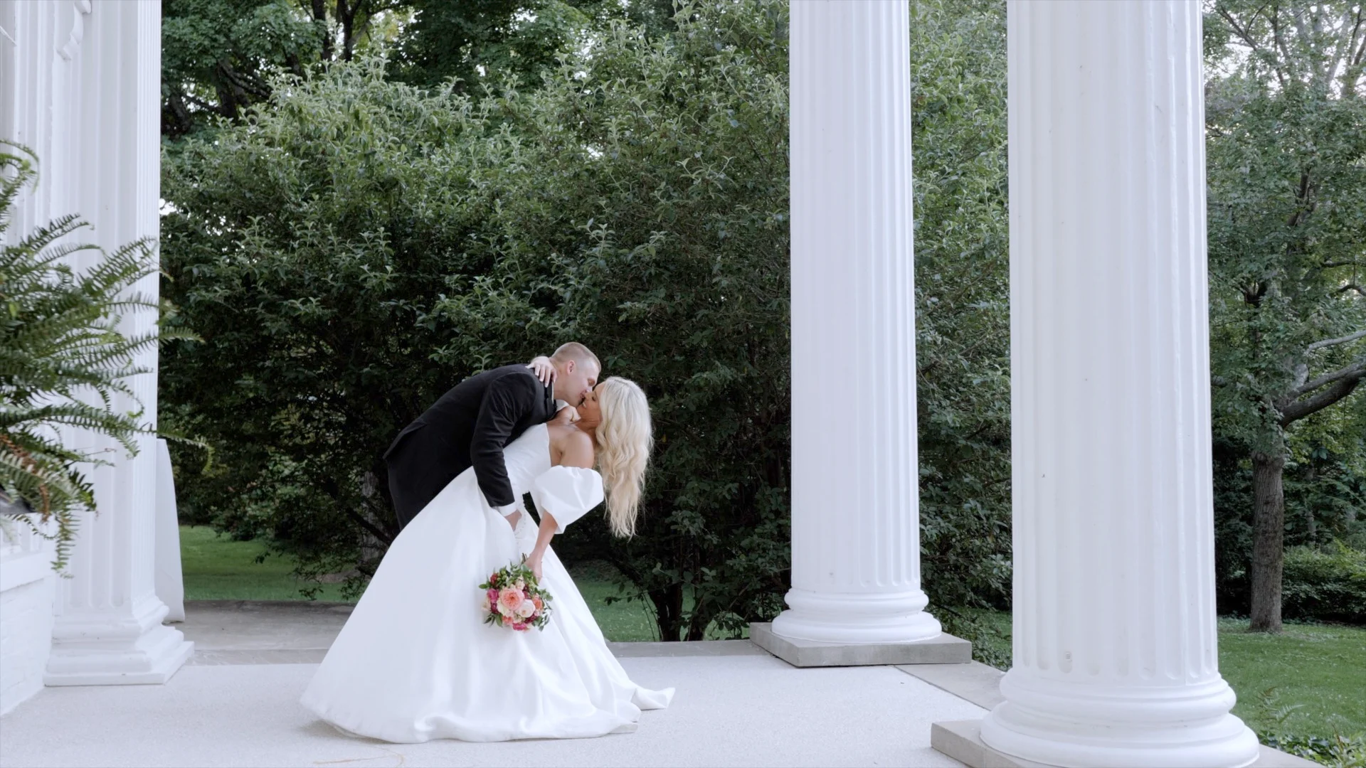 wedding portraits on front portico of Whitehall Gardens